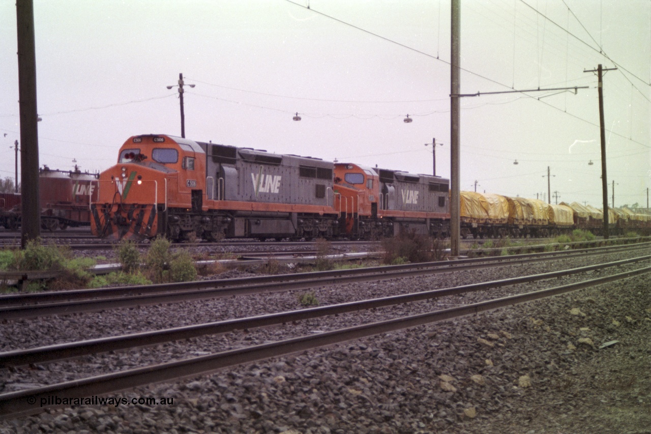 150-01
Tottenham yard, V/Line broad gauge C class locos C 506 Clyde Engineering EMD model GT26C serial 76-829 and C 510 serial 76-833 prepare their Adelaide bound goods train 9169 in rain as departure time approaches.
Keywords: C-class;C506;Clyde-Engineering-Rosewater-SA;EMD;GT26C;76-829;
