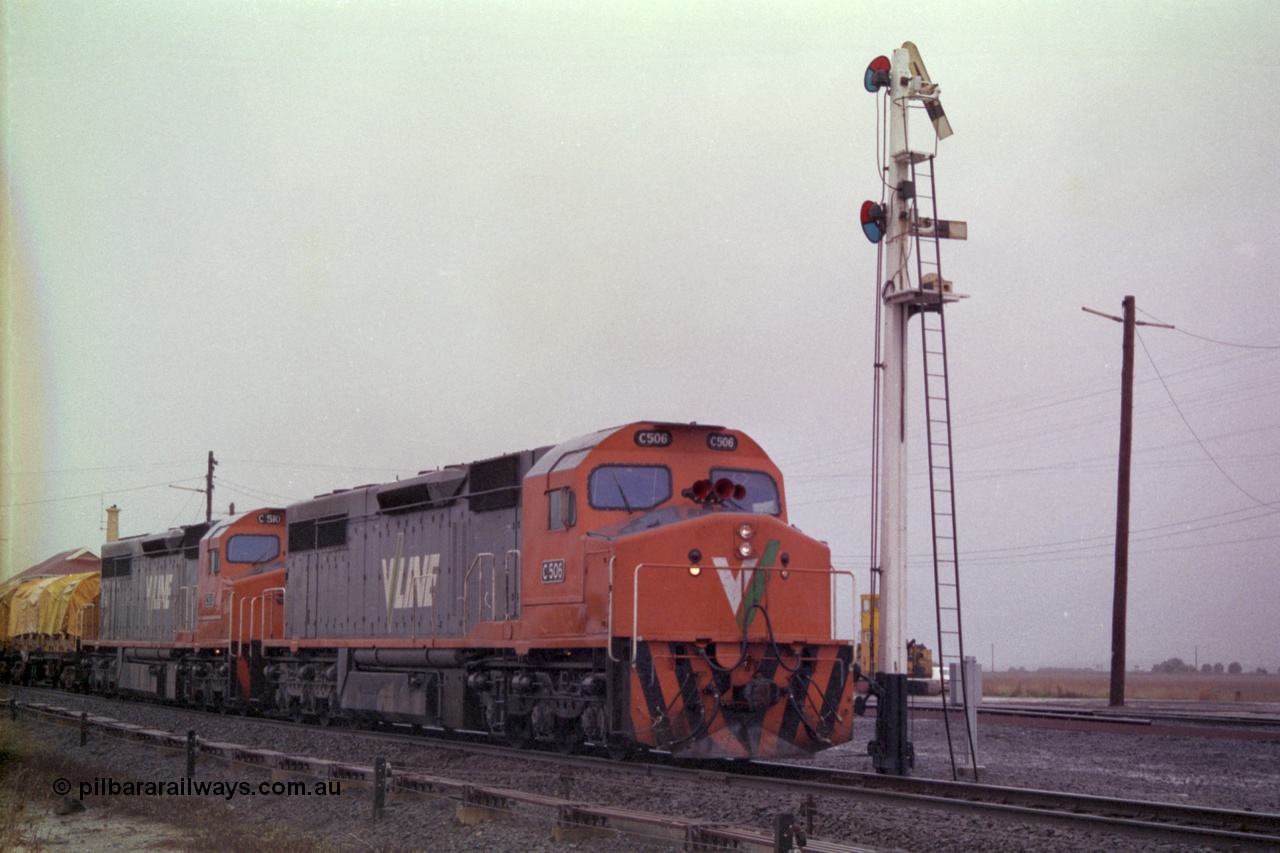 150-10
Gheringhap, broad gauge V/Line C class locos C 506 Clyde Engineering EMD model GT26C serial 76-829 and C 510 serial 76-833 lead down Adelaide goods train 9169 onto the Maroona line past semaphore signal post No.4, point rodding and signal wires in foreground.
Keywords: C-class;C506;Clyde-Engineering-Rosewater-SA;EMD;GT26C;76-829;