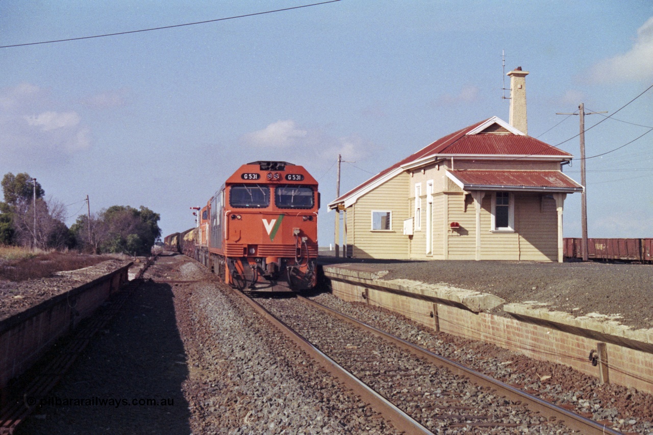 151-13
Gheringhap, broad gauge V/Line Adelaide bound goods train 9169 holds No.1 Road with G class G 531 Clyde Engineering EMD model JT26C-2SS serial 88-1261 leading C classes C 510 Clyde Engineering EMD model GT26C serial 76-833 and C 509 serial 76-832, point rodding and signal wires can been seen in this shot taken from the former No.2 road pit, gypsum waggons in the background.
Keywords: G-class;G531;Clyde-Engineering-Somerton-Victoria;EMD;JT26C-2SS;88-1261;
