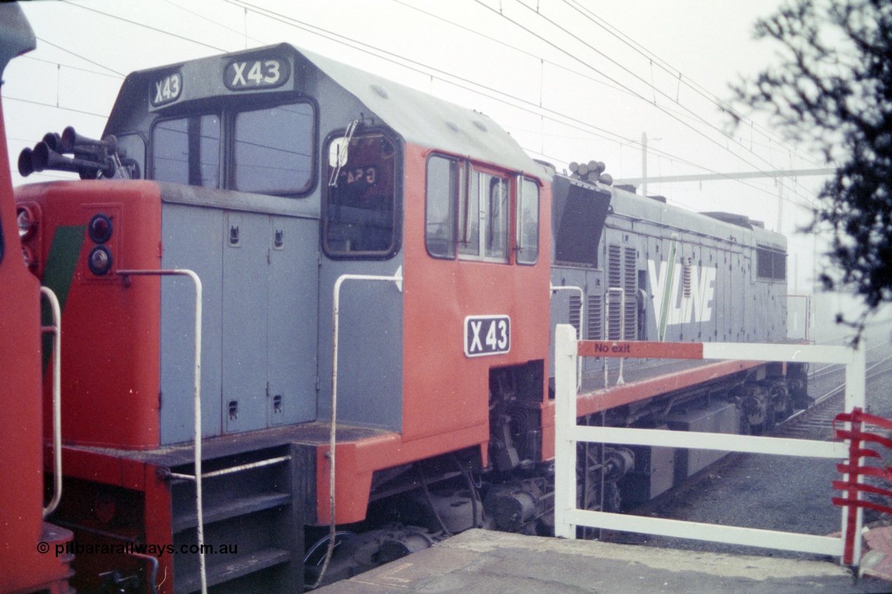 151-21
Traralgon station platform, V/Line broad gauge light engine 2nd unit X class X 43 Clyde Engineering EMD model G26C serial 70-706 awaits departure time for Morwell with 9444 light engine, then loaded briquette train for Nth Geelong, in heavy fog.
Keywords: X-class;X43;Clyde-Engineering-Granville-NSW;EMD;GT26C;70-706;
