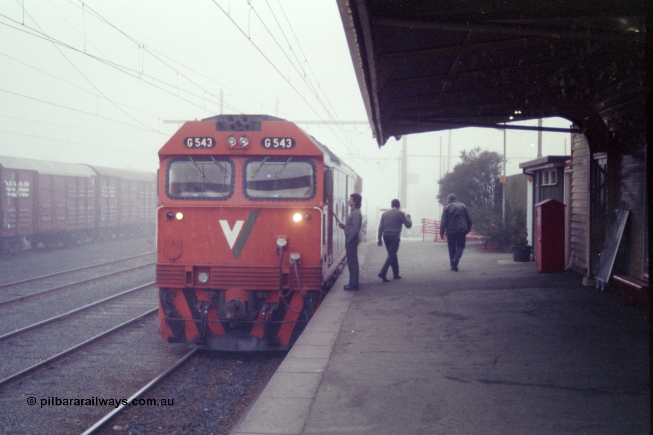 151-25
Traralgon station platform, V/Line broad gauge G class G 543 Clyde Engineering EMD model JT26C-2SS serial 89-1276 with X class X 43 Clyde Engineering EMD model G26C serial 70-706 is receiving the electric staff for Morwell on train 9444 light engine in heavy fog.
Keywords: G-class;G543;Clyde-Engineering-Somerton-Victoria;EMD;JT26C-2SS;89-1276;