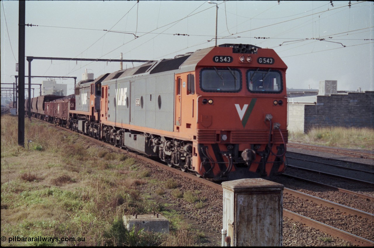 152-11
Pakenham station, V/Line broad gauge up 9444 goods to Nth Geelong arrives behind G class G 543 Clyde Engineering EMD model JT26C-2SS serial 89-1276 and X class X 43 Clyde Engineering EMD model G26C serial 70-706 with their load of briquettes.
Keywords: G-class;G543;Clyde-Engineering-Somerton-Victoria;EMD;JT26C-2SS;89-1276;