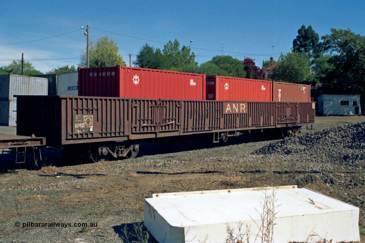 153-2-17
Ballarat station yard, broad gauge Australian National Railways AOOX type 85 foot bogie open waggon AOOX 2169 with ANR logos and three 20' TEU containers, AOOX 2169 was built by Transfield WA as one of a batch of thirty six GOX type bogie open waggons in 1970.
Keywords: AOOX-type;AOOX2169;Transfield-WA;GOX-type;