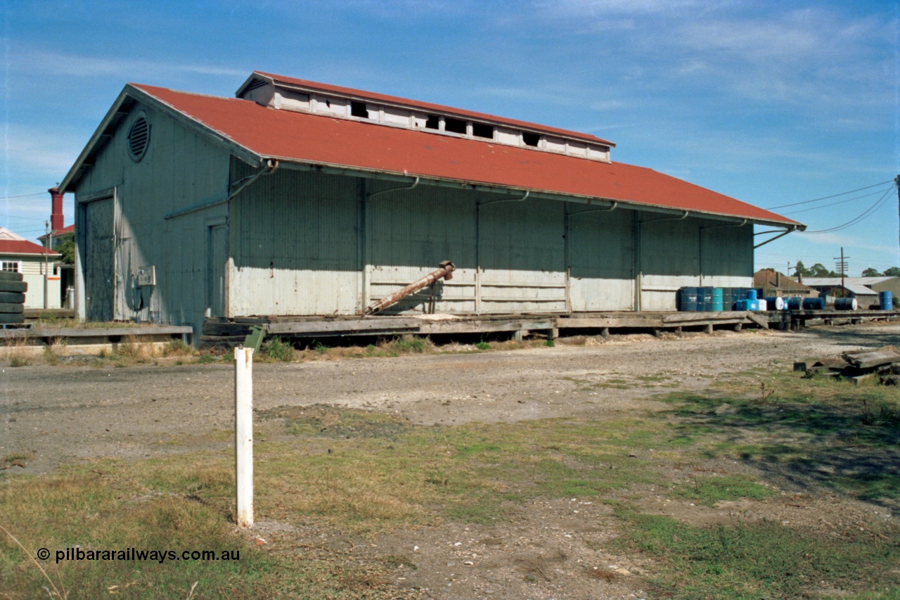 153-2-24
Beaufort goods shed, view from road side, station building and platform behind it.
