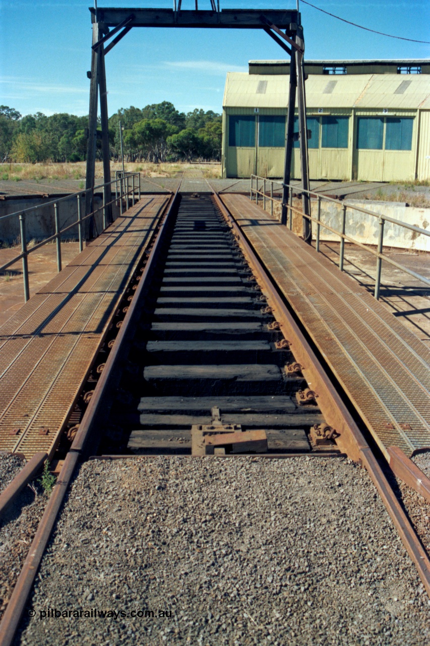 153-2-27
Ararat loco depot, turntable deck view looking from yard access track, three stall roundhouse.
