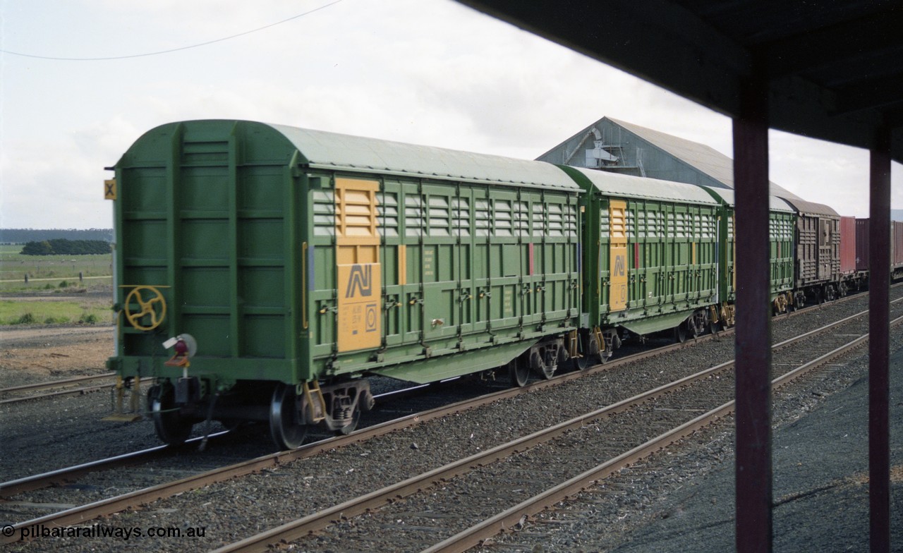 154-25
Lismore, view from station veranda, three Australian National broad gauge AHLX type bogie louvre vans in AN colours and an ANR louvre van on the rear of Adelaide bound goods train 9169.
Keywords: AHLX-type;