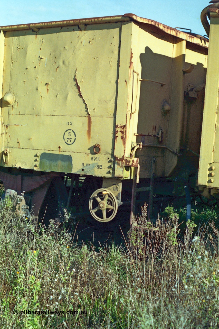 155-09
Wallan, stored 'OFF REG' waggon awaiting scrapping, four wheel waggon, GY type open waggon GY 960, detail view of hand brake wheel and shunters step.
Keywords: GY-type;GY960;fixed-wheel-waggon;