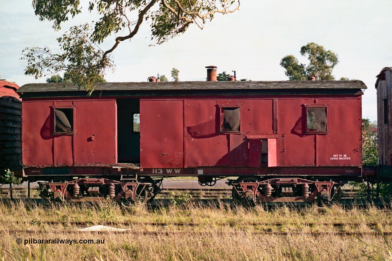 155-10
Wallan, stored 'OFF REG' waggon awaiting scrapping, bogie Ways and Works workmen's sleeper waggon, WW type 113 WW, side view. Originally built as a A type first class fixed six wheel carriage A 114 by Brown & Marshall of England in 1883, recoded to X type X 63 in circa 1910, then in 1946 converted to a workman's sleeper W type at Newport workshops as W 58. And in 1959 at Bendigo workshops fitted to a bogie underframe and converted to WW.
Keywords: WW-type;WW113;Brown&Marshall;A-type;A114;X-type;X63;W-type;W58;
