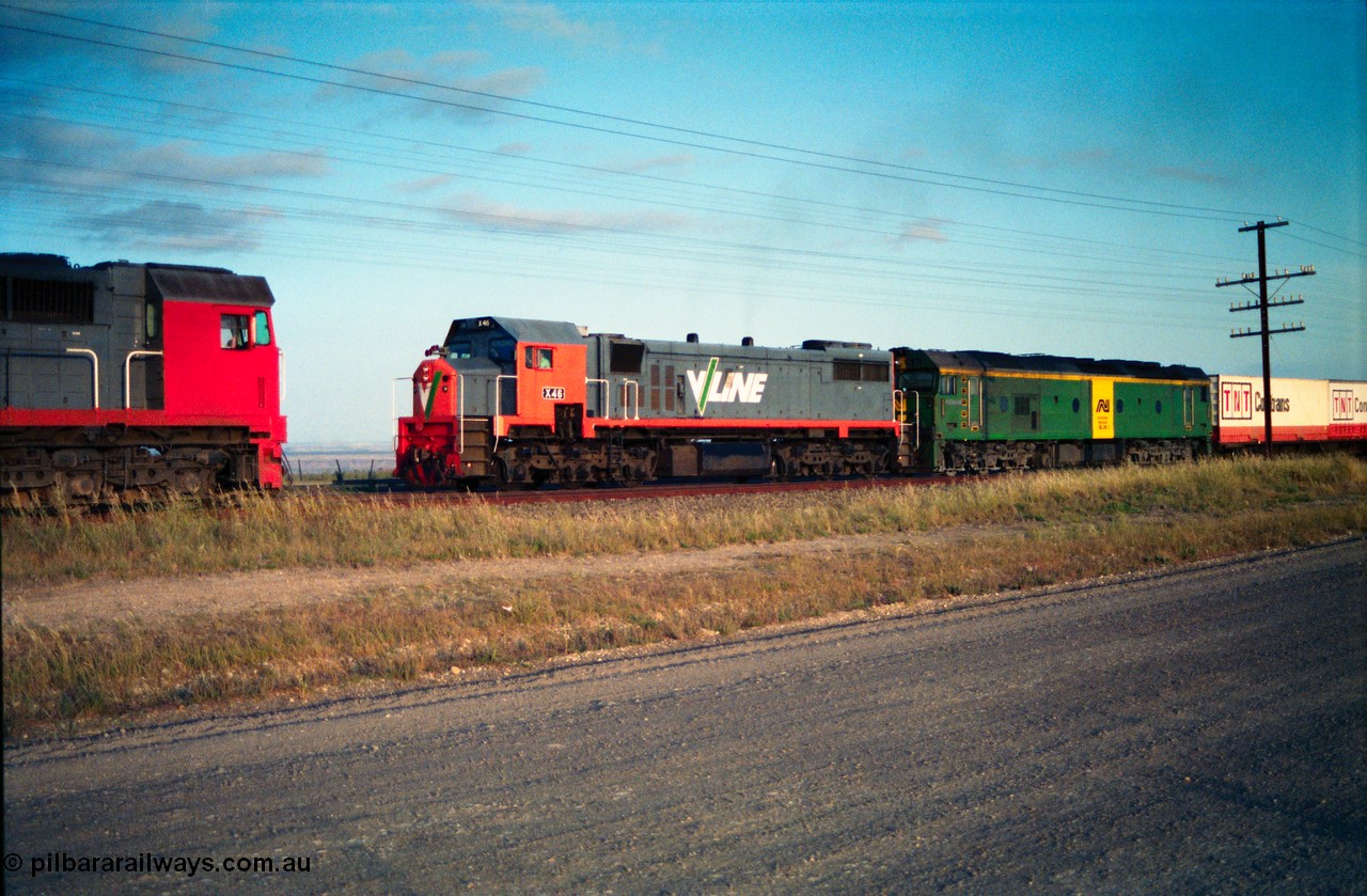 156-01
Bank Box Loop, broad gauge V/Line N class N 471 'City of Benalla' Clyde Engineering EMD model JT22HC-2 serial 87-1200 sits on the loop as V/Line X class X 46 Clyde Engineering EMD model G26C serial 75-793 and Australian National BL class leader BL 26 'Bob Hawke' Clyde Engineering EMD model JT26C-2SS serial 83-1010 leads an Adelaide bound Super Freighter on the mainline.
Keywords: N-class;N471;Clyde-Engineering-Somerton-Victoria;EMD;JT22HC-2;87-1200;