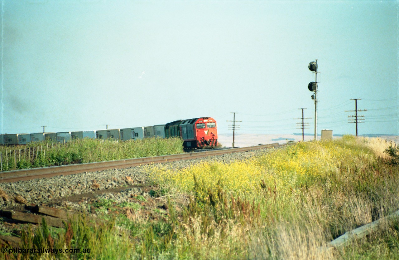 159-03
Bank Box Loop, distant view of a down Adelaide bound broad gauge goods train rounding the curve with the super elevation of the mainline visible being hauled by V/Line G class G 540 Clyde Engineering EMD model JT26C-2SS serial 89-1273 and Australian National 700 class 704 AE Goodwin ALCo model DL500G serial G6059-2.
Keywords: G-class;G540;Clyde-Engineering-Somerton-Victoria;EMD;JT26C-2SS;89-1273;