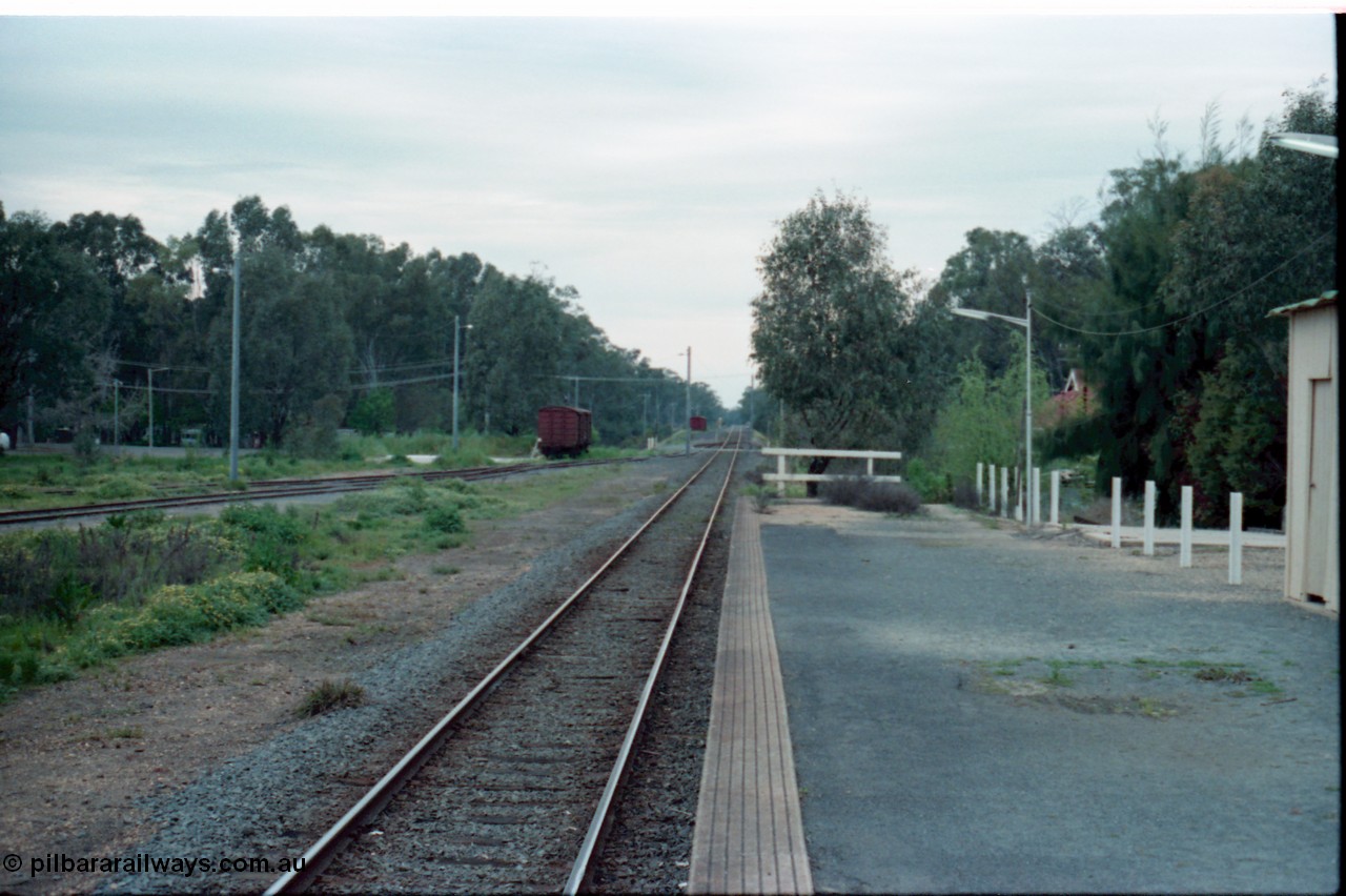 160-15
Mooroopna, view from station platform looking towards Shepparton, bogie louvre van sitting in the former stock yards siding, while another van is in the distance near the Goulburn River bridge.
