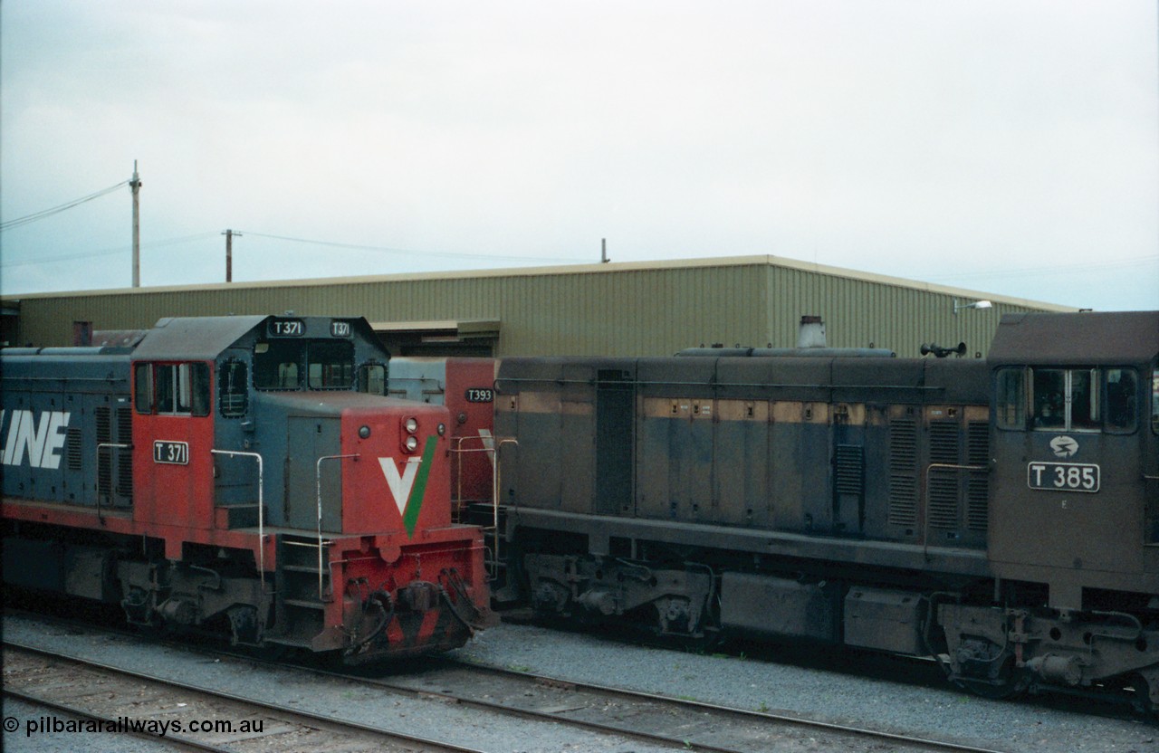 160-18
Shepparton, stabled V/Line broad gauge T class locomotives, T 371 Clyde Engineering EMD model G8B serial 64-326, T 385 serial 64-340 still in Victorian Railways livery of blue and yellow and T 393 serial 65-423.
Keywords: T-class;T371;Clyde-Engineering-Granville-NSW;EMD;G8B;64-326;