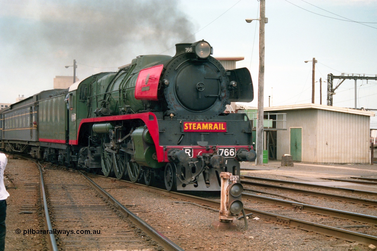 162-1-21
Spencer Street Station, broad gauge Steamrail R class R 766 North British Locomotive Company, Glasgow, Scotland model Hudson serial 27056 departs platform 4 with a down steam hauled passenger train during the PTC open Day, ground dwarf 155.
Keywords: R-class;R766;North-British-Locomotive-Company;Hudson;27056;