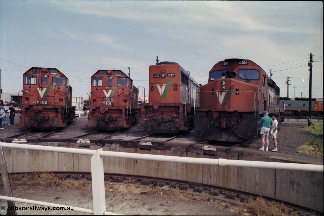 162-2-10
South Dynon Motive Power Depot, standard gauge turntable, radial roads and pit, V/Line locomotives lined up are Y class Y 102 Clyde Engineering EMD model G6B serial 63-292, Y class leader Y 101 serial 63-291, X class X 37 Clyde Engineering EMD model G26C serial 70-700 and C class C 504 Clyde Engineering EMD model GT26C serial 76-827. PTC Open Day.
Keywords: C-class;C504;Clyde-Engineering-Rosewater-SA;EMD;GT26C;76-827;