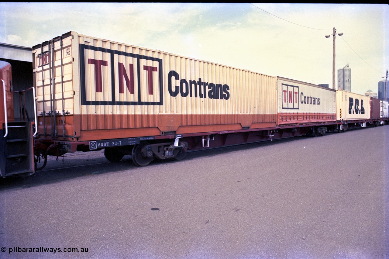 162-3-07
Melbourne Yard, V/Line broad gauge VQDW type 80 foot bogie container waggon, built by Newport Workshops in September 1975 as an FCF Bogie Jumbo Container Flat, VQDW 23 with TNT Contrans 40 foot containers, PTC Open Day.
Keywords: VQDW-type;VQDW23T;Victorian-Railways-Newport-WS;FCF-type;