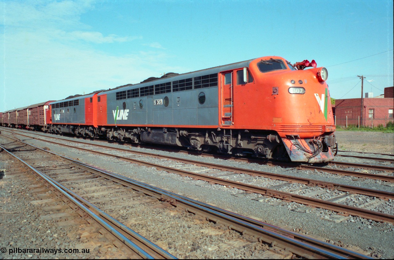 163-05
Seymour station yard, stabled V/Line down broad gauge Wodonga goods train in the rationalised yard behind the classic back to back pair of streamlined Bulldogs S classes S 307 'John Pascoe Fawkner' Clyde Engineering EMD model A7 serial 57-171' and S 311 'Sir Ferdinand von Mueller' serial 60-228 with a rake of louvre vans leading.
Keywords: S-class;S307;Clyde-Engineering-Granville-NSW;EMD;A7;57-171;bulldog;