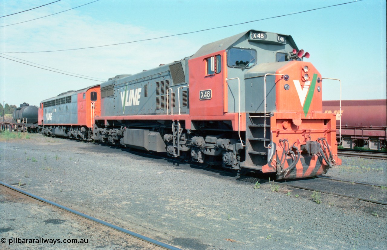 163-13
Seymour loco depot, V/Line broad gauge locomotives third series X class X 48 Clyde Engineering EMD model G26C serial 75-795 and S class S 303 'C J Latrobe' Clyde Engineering EMD model A7 serial 57-167 stabled over the weekend, bogie fuel tank and ballast waggons in the background.
Keywords: X-class;X48;Clyde-Engineering-Rosewater-SA;EMD;G26C;75-795;