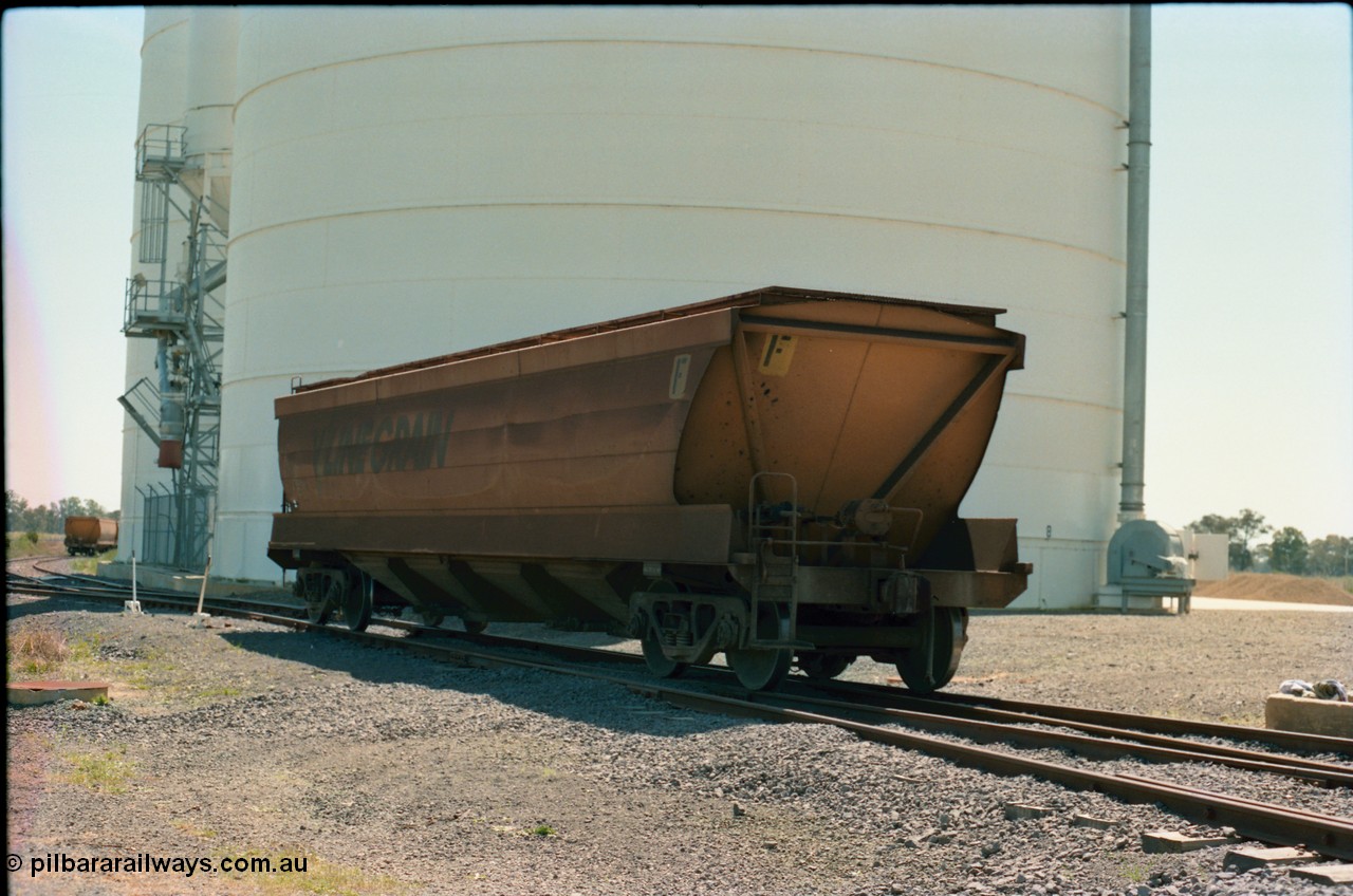 164-18
Murchison East, V/Line Grain VHGF type bogie grain waggon VHGF 119, built as a GJX type by Steelweld Victoria in January 1969, is loose shunted down the gravitational road loaded towards the loaded rake, rolling past the Ascom Jumbo silo complex, show non-handbrake end of waggon.
Keywords: VHGF-type;VHGF119;Steelweld-Vic;GJX-type;