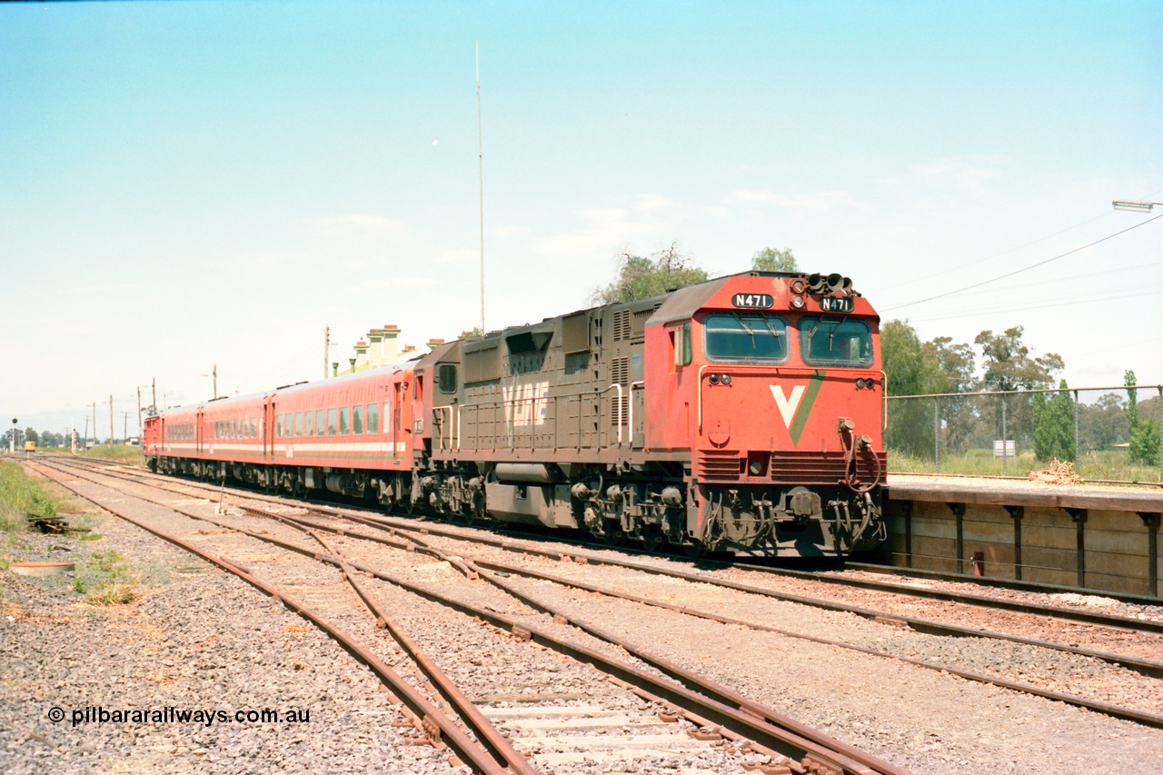 164-21
Murchison East, V/Line broad gauge N class loco N 471 'City of Benalla' Clyde Engineering EMD model JT22HC-2 serial 87-1200 with the standard N set and D van with the down Cobram passenger train paused at the platform, tracks in foreground have seen recent re-sleepering and ballasting work.
Keywords: N-class;N471;Clyde-Engineering-Somerton-Victoria;EMD;JT22HC-2;87-1200;