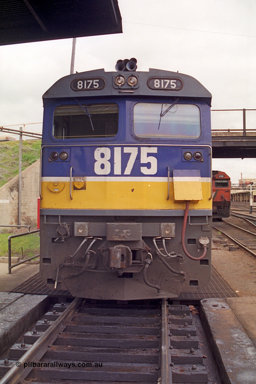 166-07
Albury loco depot fuel point, NSWSRA standard gauge 81 class locomotive 8175 Clyde Engineering EMD model JT26C-2SS serial 85-1094, cab front view in Freight Rail livery.
Keywords: 81-class;8175;Clyde-Engineering-Kelso-NSW;EMD;JT26C-2SS;85-1094;