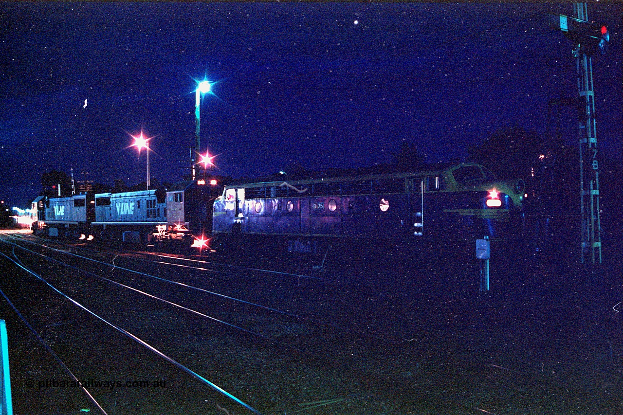 166-14
Benalla, night time yard view of V/Line broad gauge up Long Island slab steel train 9334 behind X classes X 46 and X 45 'Edgar H Brownbill' Clyde Engineering EMD models G26C serials 75-793 and 75-792 with veteran B class Bulldog B 75 Clyde Engineering EMD model ML2 serial ML2-16 as it waits to cross passenger trains before heading south.
Keywords: B-class;B75;Clyde-Engineering-Granville-NSW;EMD;ML2;ML2-16;bulldog;