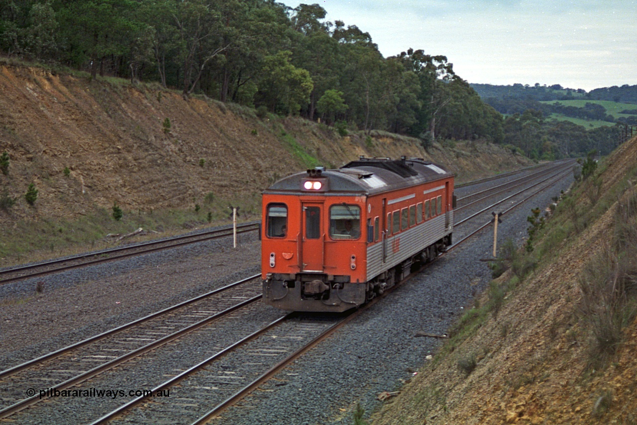 166-19
Heathcote Junction, down V/Line broad gauge passenger service to Seymour consisting of Tulloch Ltd built DRC class diesel rail car climbing up hill to the summit.
Keywords: DRC-class;Tulloch-Ltd-NSW;