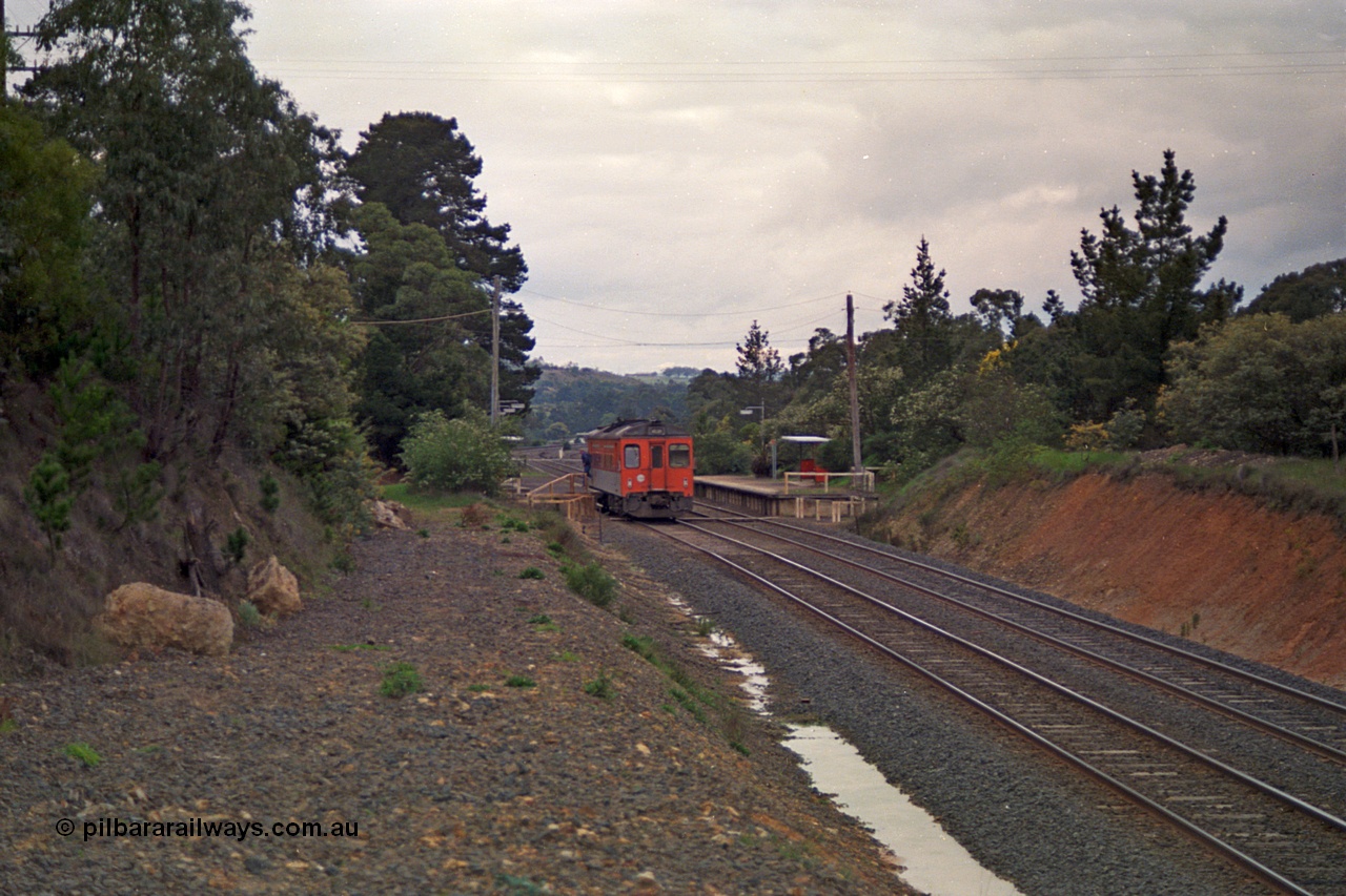 166-20
Heathcote Junction, looking north from the former Heathcote line run-away road, V/Line broad gauge Tulloch Ltd built DRC class diesel rail car has paused at the down platform while operating a Seymour service, the standard gauge line is behind the embankment on the right.
Keywords: DRC-class;Tulloch-Ltd-NSW;