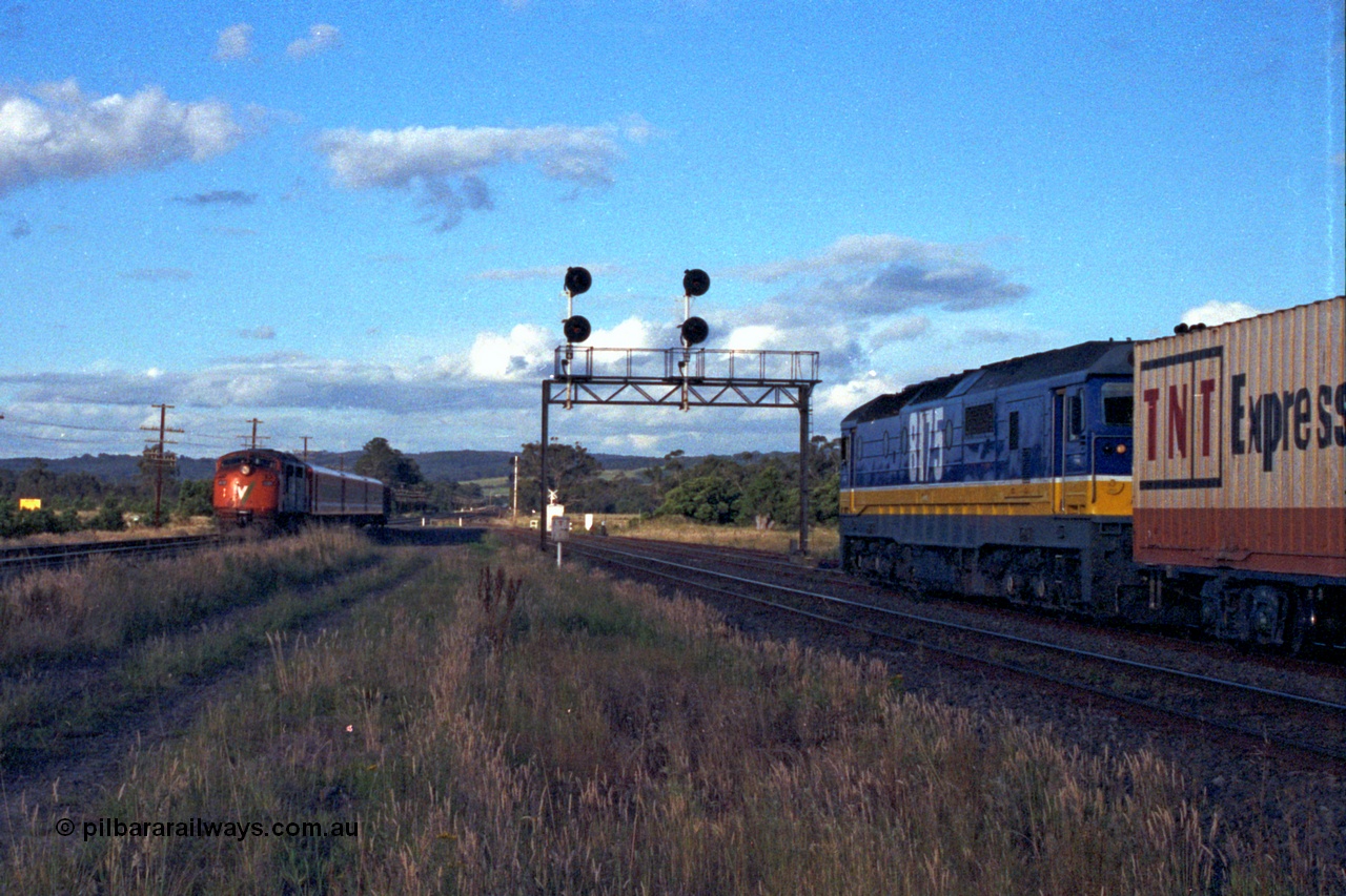 167-04
Wallan Loop, north end, standard gauge NSWSRA 81 class loco 8175 Clyde Engineering EMD model JT26C-2SS serial 85-1094 holds the loop, framed by the signal gantry awaiting a cross with the south bound Inter-Capital Daylight. 8175 is wearing the new Freight Rail 'Stealth' livery.
Keywords: 81-class;8175;Clyde-Engineering-Kelso-NSW;EMD;JT26C-2SS;85-1094;