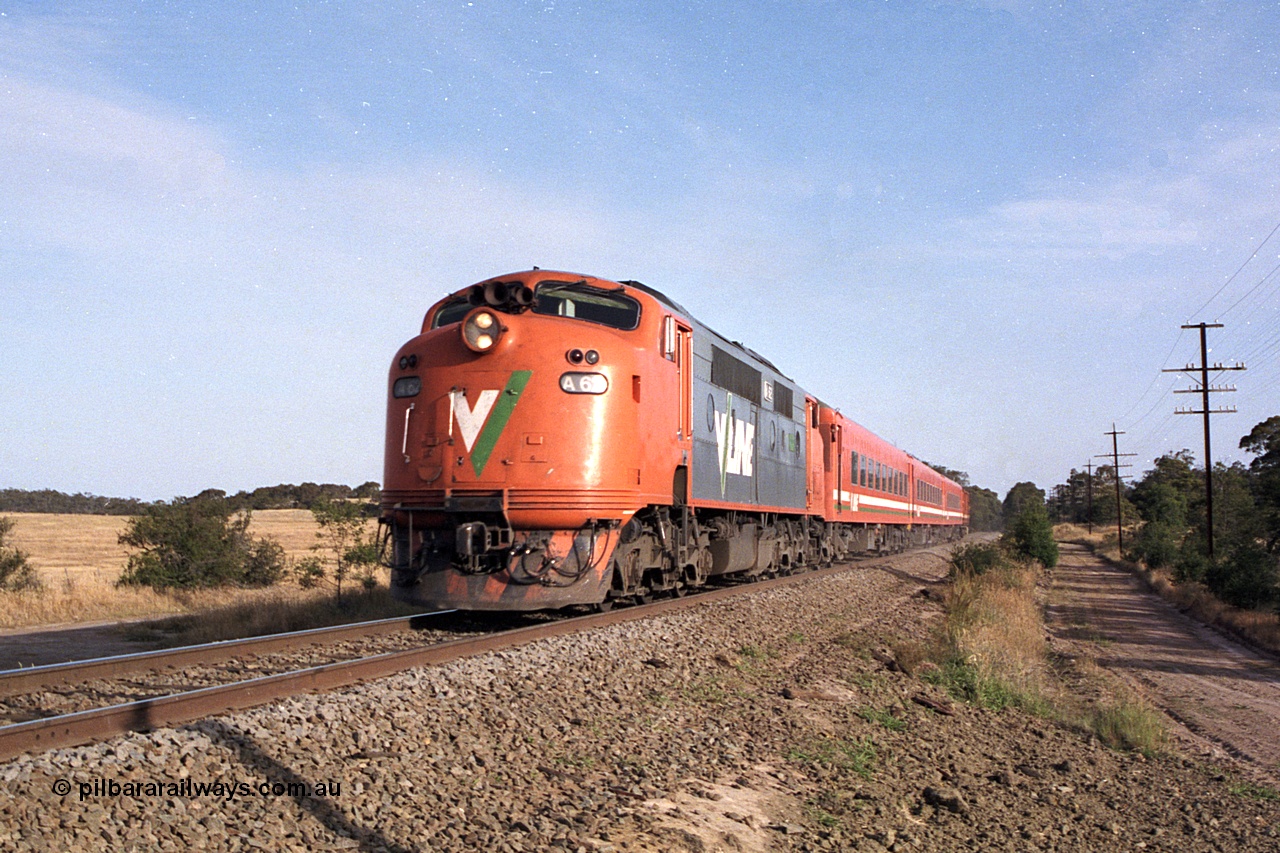 168-02
Bank Box Loop, down broad gauge V/Line passenger service powered by rebuilt A class Bulldog A 62 Clyde Engineering EMD model AAT22C-2R serial 84-1183 rebuilt from B class B 62 Clyde Engineering EMD model ML2 serial ML2-3 with N set and D van at Ironbark Road grade crossing.
Keywords: A-class;A62;Clyde-Engineering-Rosewater-SA;EMD;AAT22C-2R;84-1183;rebuild;bulldog;