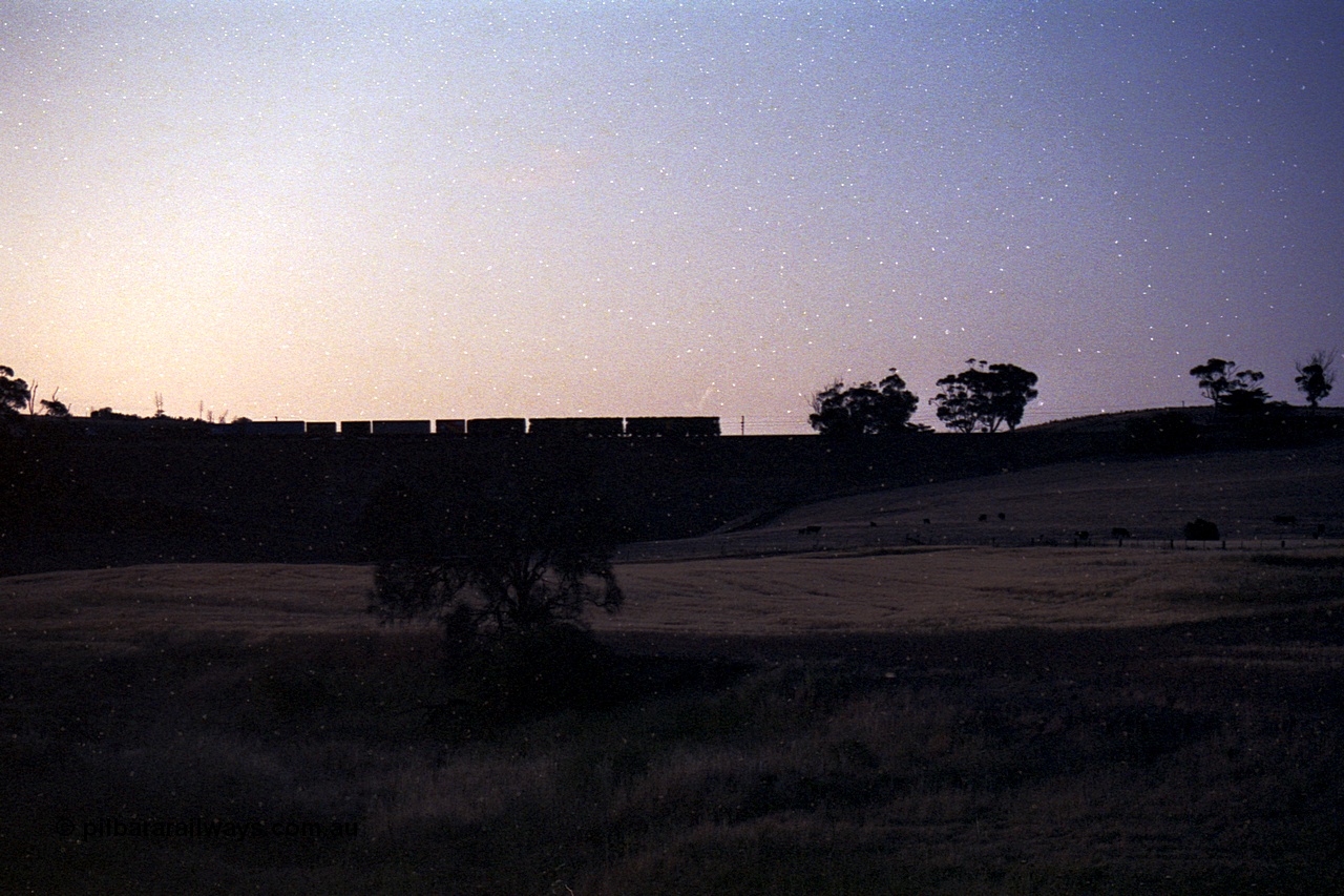 168-16
Rowsley, double broad gauge Australian National BL class units power another Adelaide bound freighter.
