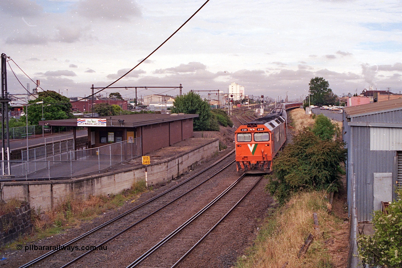 168-21
West Footscray, looking west toward Tottenham at broad gauge separation junction, V/Line standard gauge G class Co-Co locomotive G 518 Clyde Engineering EMD model JT26C-2SS serial 85-1231 leads the up Melbourne Express passenger service from Sydney.
Keywords: G-class;G518;Clyde-Engineering-Rosewater-SA;EMD;JT26C-2SS;85-1231;