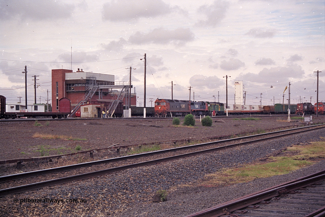 168-23
Tottenham Yard, an up broad gauge goods train with motive power from V/Line G class G 533 Clyde Engineering EMD model JT26C-2SS serial 88-1263, X class X 49 Clyde Engineering EMD model G26C serial 75-796 and Australian National 700 class 704 AE Goodwin ALCo model DL500G serial G6059-2 locomotives departs the yard for Melbourne.
Keywords: G-class;G533;Clyde-Engineering-Somerton-Victoria;EMD;JT26C-2SS;88-1263;