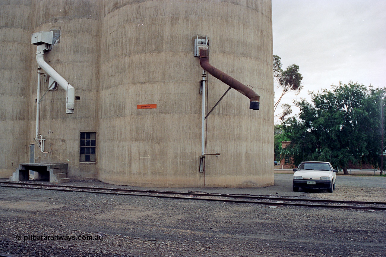 170-12
Devenish, load-out spouts on Williamstown style silo complex, track view, 1988 Ford XF Falcon ute.
