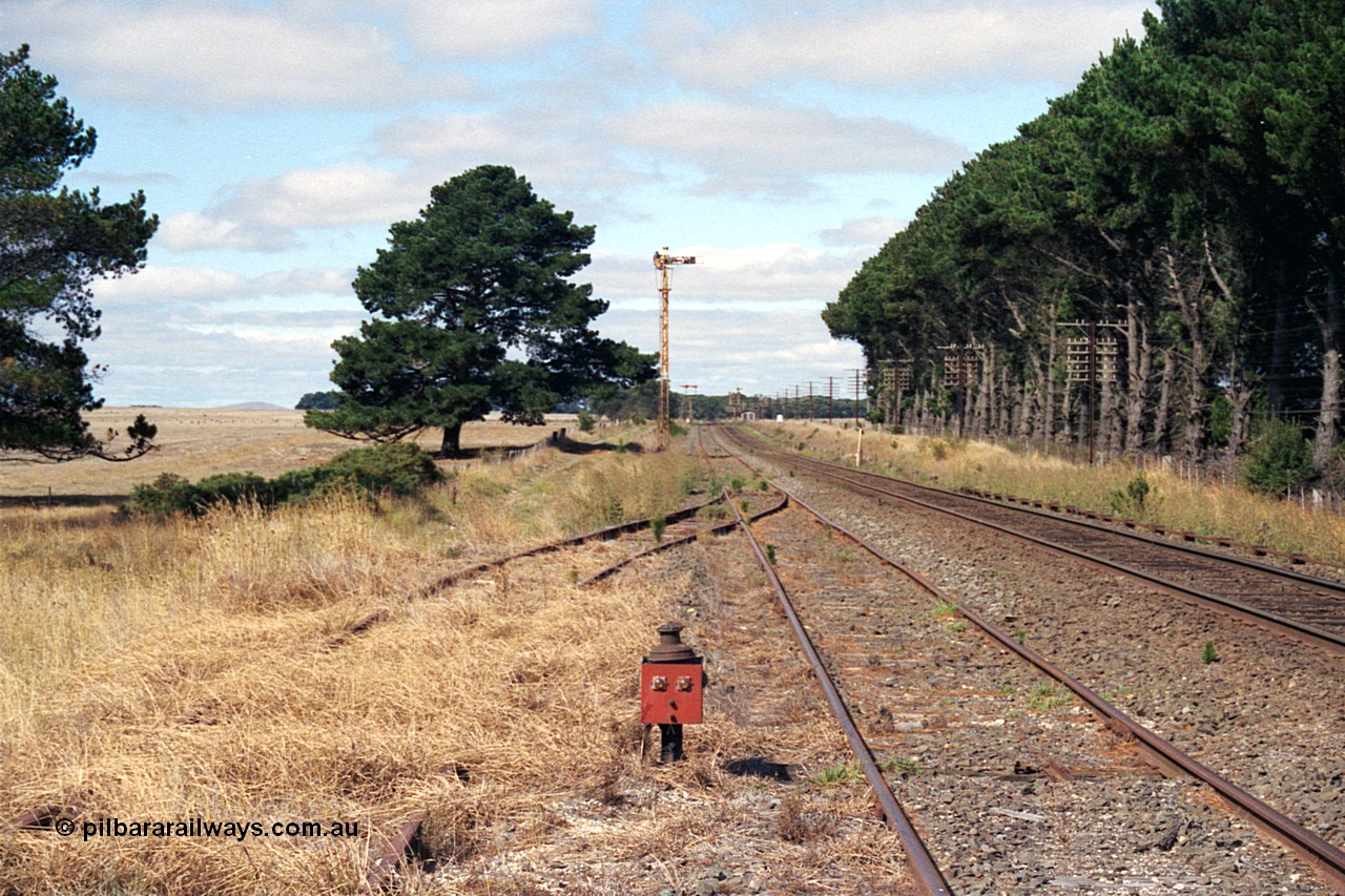 171-10
Trawalla station yard overview, looking towards Melbourne, end of No.3 Rd former stock yards would be directly left of this image, point indicator for catch points in grass, Down Home semaphore Signal Post 4 for moves from No.2A Road to No.2 Road.
