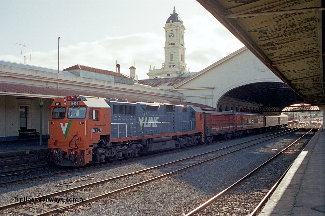 171-19
Ballarat station, clock tower, V/Line broad gauge N class N 457 'City of Mildura' Clyde Engineering EMD model JT22HC-2 serial 85-1225 with D van and N set sitting at platform with an Up passenger train.
Keywords: N-class;N457;Clyde-Engineering-Somerton-Victoria;EMD;JT22HC-2;85-1225;