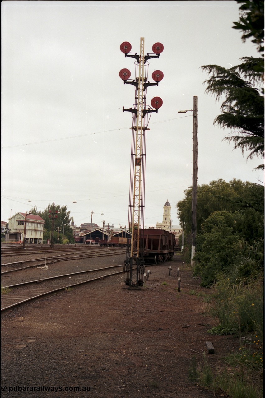 172-18
Ballarat yard view, disc signal post 12, station clock tower in background and Ballarat A signal box at left.
