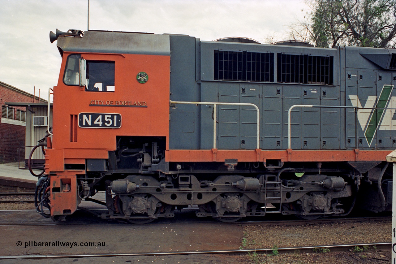 174-04
Wodonga, V/Line broad gauge locomotive N class leader N 451 'City of Portland' Clyde Engineering EMD model JT22HC-2 serial 85-1219, cab side view of nameplate, crest and number plate, bogie and staff exchanger detail.
Keywords: N-class;N451;Clyde-Engineering-Somerton-Victoria;EMD;JT22HC-2;85-1219;