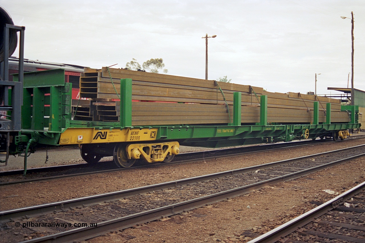 174-11
Albury, yard view, Australian National standard gauge AKNF type bogie steel transport waggon AKNF 2210 built by Mechanical Handling Ltd SA in 1970 as RN type, recoded to AFNY, converted to bulk steel in 1987, with a load of I beams on a south bound Melbourne goods train, fuel point is visible behind waggon.
Keywords: AKNF-type;AKNF2210;Mechanical-Handling-Ltd-SA;RN-type;AFNY-type;