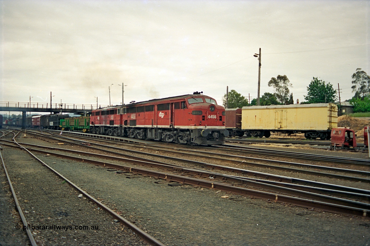 174-23
Albury, yard view from station dock area, NSWSRA standard gauge Red Terror liveried pair of 44 class 4456 AE Goodwin ALCo model DL500B serial 83746 and 4458 AE Goodwin ALCo model DL500B serial 83748 shunt the north with a Melbourne bound goods train.
Keywords: 44-class;4456;AE-Goodwin;ALCo;DL500B;83746;