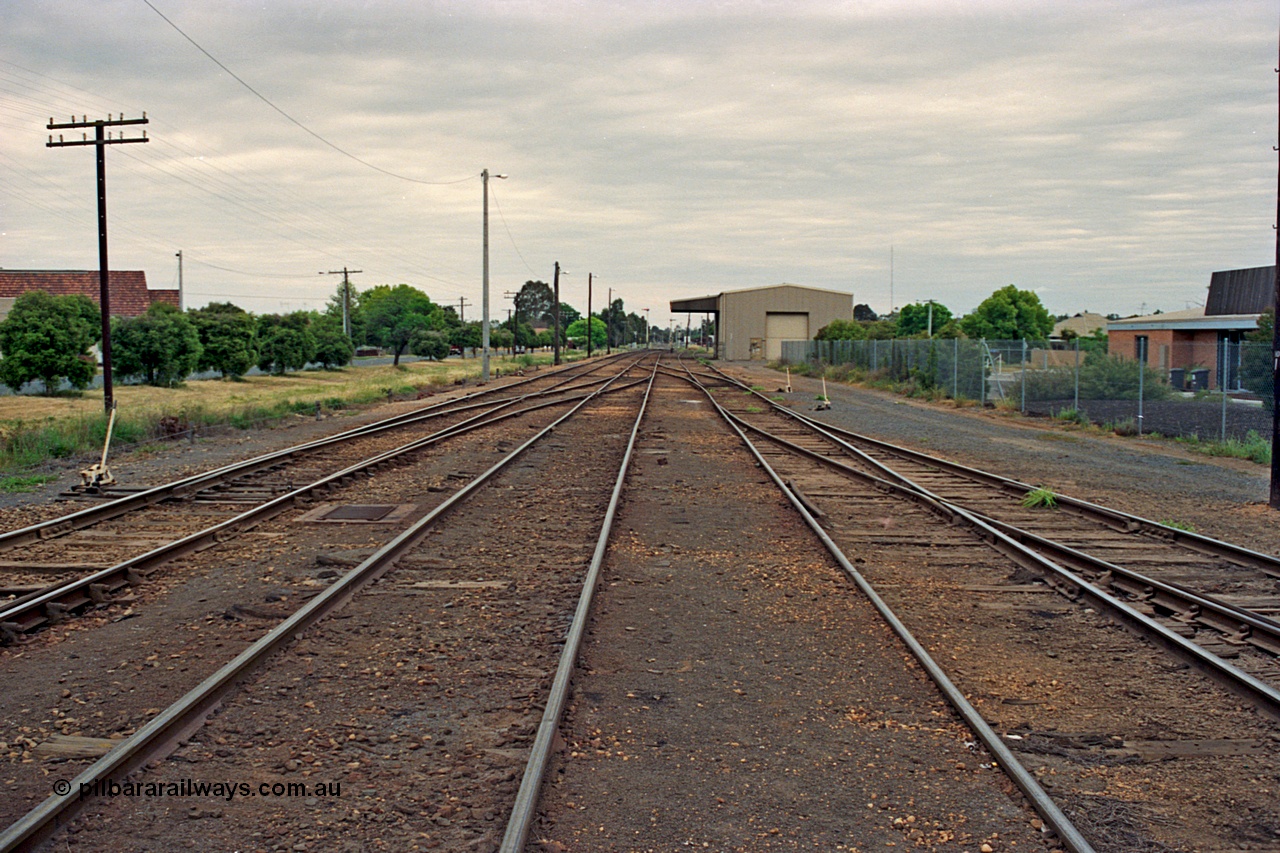 175-10
Shepparton yard overview looking south, at the far left just visible are the points to the Weighbridge Sidings with a cross-over from No.1 to No.2 Roads, start of yard ladder on the right and disused loading shed with canopy in the background.

