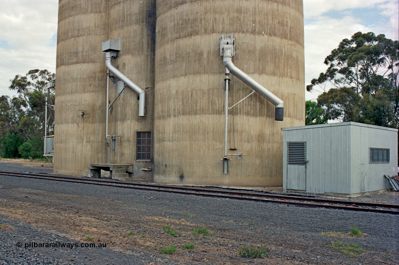 175-17
Pine Lodge, track view looking at load-out spouts on Williamstown style silo complex, staff / storage shed.
