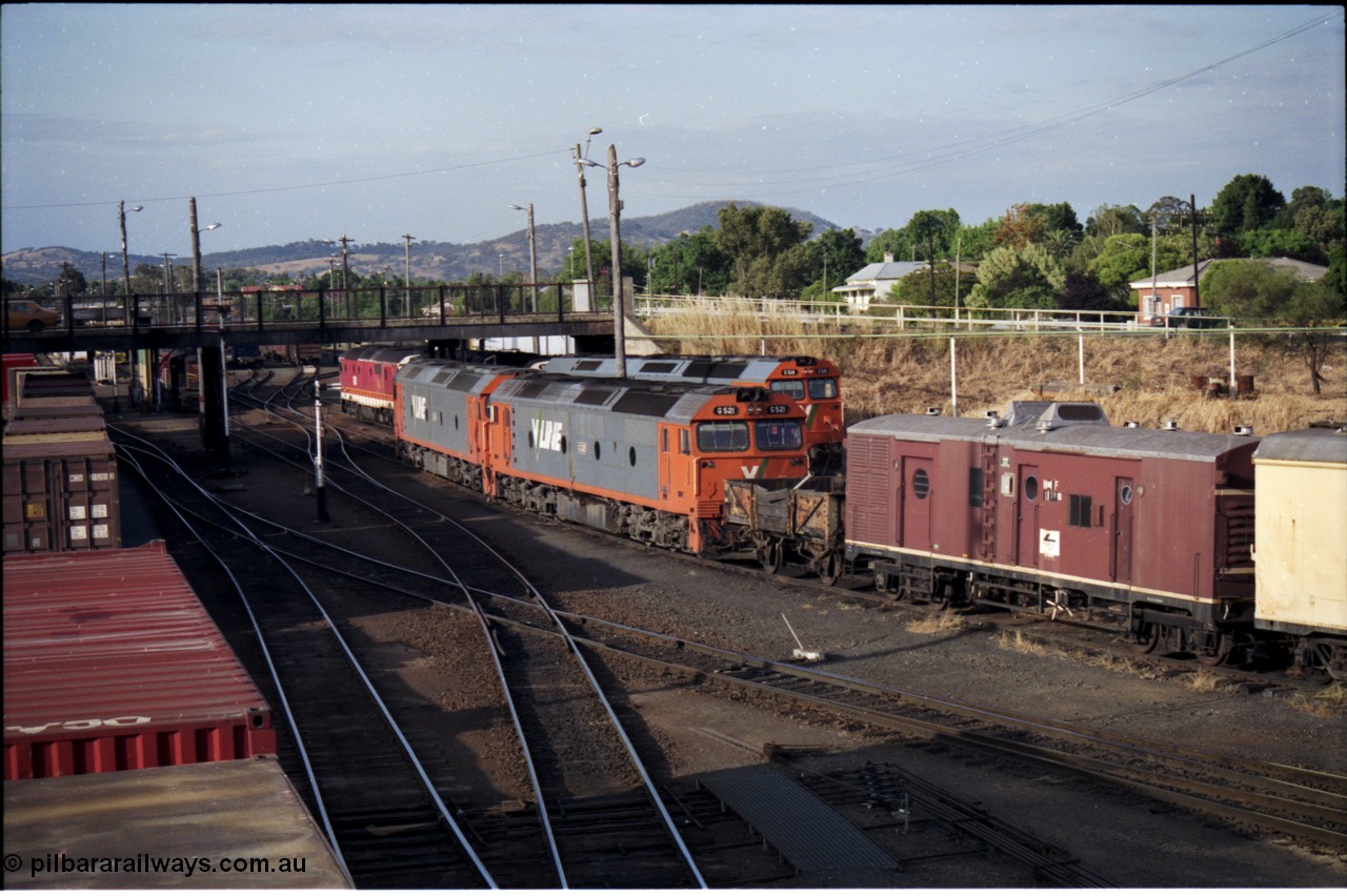 176-15
Albury, yard view looking north from footbridge, three V/Line standard gauge G class locomotives and a couple of NSWSRA 81 class units occupy the loco depot tracks awaiting their next call to duty.
Keywords: G-class;G521;Clyde-Engineering-Rosewater-SA;EMD;JT26C-2SS;85-1234;