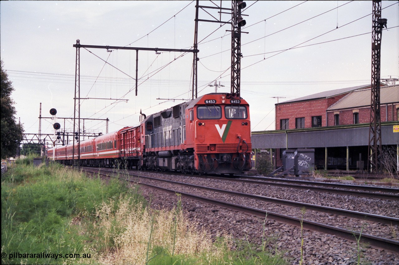 177-05
Newport Junction, V/Line broad gauge N class locomotive N 453 'City of Albury' Clyde Engineering EMD model JT22HC-2 serial 85-1221 leads an up Warrnambool passenger train with D van and 5 car Z set.
Keywords: N-class;N453;Clyde-Engineering-Somerton-Victoria;EMD;JT22HC-2;85-1221;