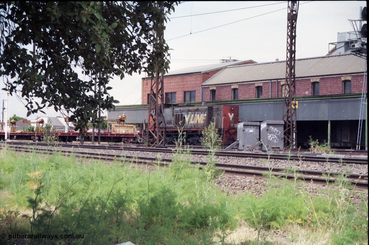 177-07
Newport Junction, V/Line broad gauge shunt locomotive Y class Y 130 Clyde Engineering EMD model G6B serial 65-396 leads a rail recovery train of VZRF class bogie welded rail transport waggons, along the Newport - Sunshine Loop Line in front of the Victorian Oatgrowers Pool Siding.
Keywords: Y-class;Y130;Clyde-Engineering-Granville-NSW;EMD;G6B;65-396;