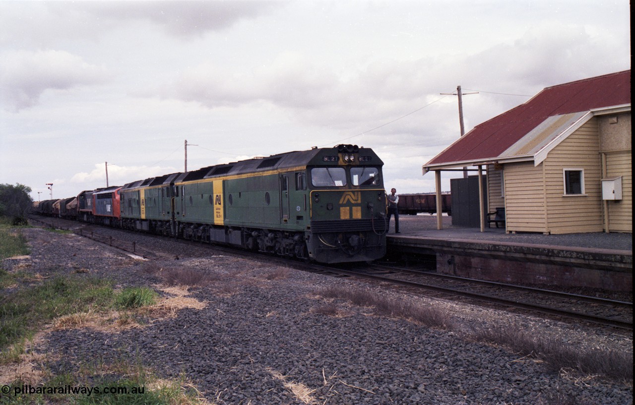 177-17
Gheringhap, down V/Line broad gauge goods train to Adelaide 9169 drifts to a stand as the driver surrenders the electric staff to the signaller for a train order, behind Australian National BL class locomotives BL 27 Clyde Engineering EMD model JT26C-2SS serial 83-1011 and class leader BL 26 'Bob Hawke' serial 83-1010 and V/Line S class S 313 'Alfred Deakin' Clyde Engineering EMD model A7 serial 61-230 and X class X 53 Clyde Engineering EMD model G26C serial 75-800.
Keywords: BL-class;BL27;Clyde-Engineering-Rosewater-SA;EMD;JT26C-2SS;83-1011;