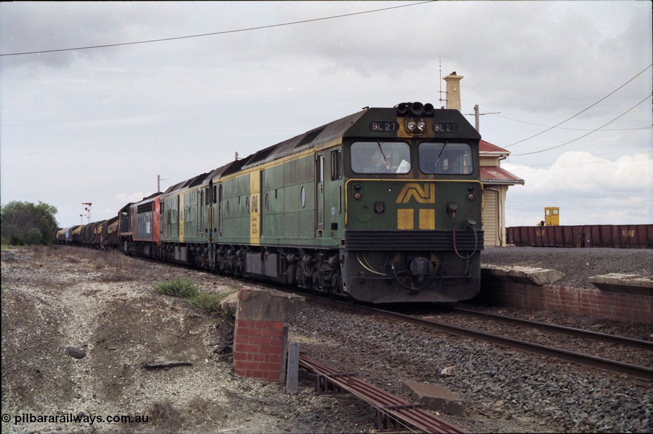 177-20
Gheringhap, down V/Line broad gauge goods train to Adelaide 9169 with the quad power combo of a pair of Australian National BL class locomotives BL 27 Clyde Engineering EMD model JT26C-2SS serial 83-1011 and class leader BL 26 'Bob Hawke' serial 83-1010 and V/Line S class S 313 'Alfred Deakin' Clyde Engineering EMD model A7 serial 61-230 and X class X 53 Clyde Engineering EMD model G26C serial 75-800, BL 27 had Paul Keating drawn on the LHS cab as it was just after he'd taken the Labor Party leadership and the Prime Ministership off Bob Hawke.
Keywords: BL-class;BL27;Clyde-Engineering-Rosewater-SA;EMD;JT26C-2SS;83-1011;