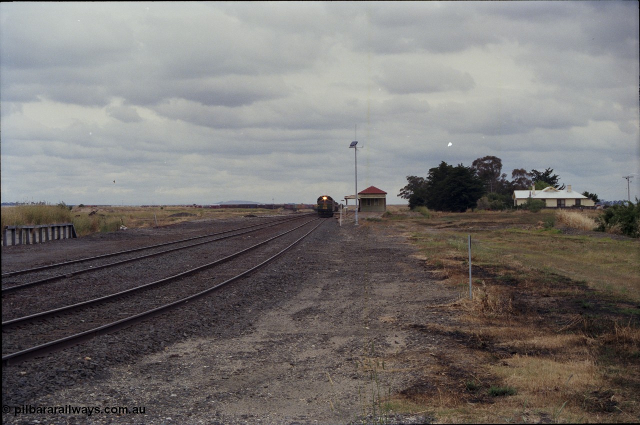 178-01
Cressy, the peace of this once former four way junction station is shattered as V/Line down broad gauge goods train 9169 to Adelaide powers past the station building along the crossing loop behind a quad of screaming EMD 2 stroke locomotives, an Australian National BL class is leading the charge.
