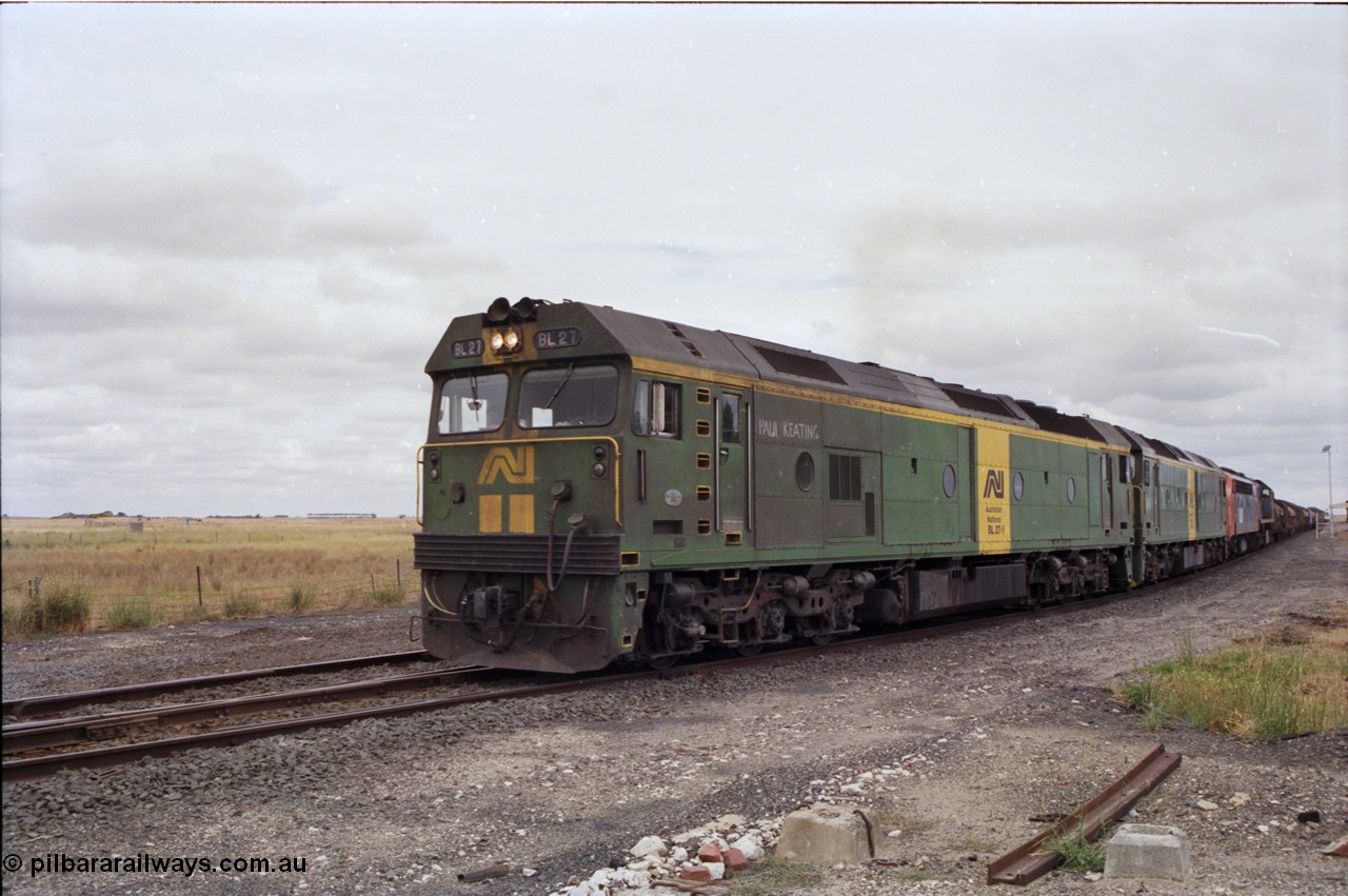 178-03
Cressy, down V/Line broad gauge goods train to Adelaide 9169 powers through the loop towards Ararat with the quad combo of a pair of Australian National BL class locomotives BL 27 Clyde Engineering EMD model JT26C-2SS serial 83-1011 and class leader BL 26 'Bob Hawke' serial 83-1010 with V/Line S class S 313 'Alfred Deakin' Clyde Engineering EMD model A7 serial 61-230 and X class X 53 Clyde Engineering EMD model G26C serial 75-800, BL 27 had Paul Keating drawn on the LHS cab as it was just after he'd taken the Labor Party leadership and the Prime Ministership off Bob Hawke.
Keywords: BL-class;BL27;Clyde-Engineering-Rosewater-SA;EMD;JT26C-2SS;83-1011;