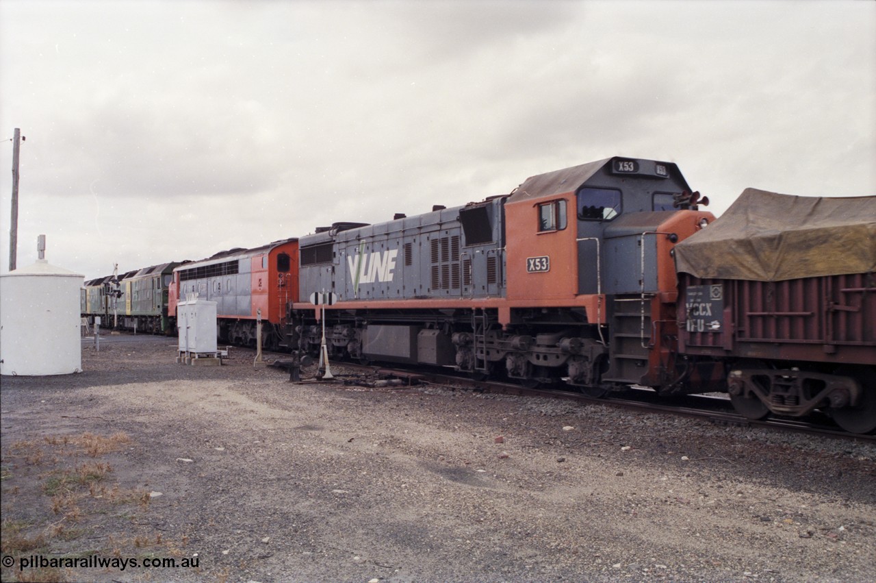 178-05
Cressy, down V/Line broad gauge goods train to Adelaide 9169 powers through the trailable points at the western end of the loop heading towards Ararat, 3rd and 4th units V/Line S class S 313 'Alfred Deakin' Clyde Engineering EMD model A7 serial 61-230 and V/Line X class loco X 53 with serial 75-800 a Clyde Engineering Rosewater SA built EMD model G26C behind Australian National BL class locomotives BL 27 Clyde Engineering EMD model JT26C-2SS serial 83-1011 and class leader BL 26 'Bob Hawke' serial 83-1010.
Keywords: X-class;X53;Clyde-Engineering-Rosewater-SA;EMD;G26C;75-800;