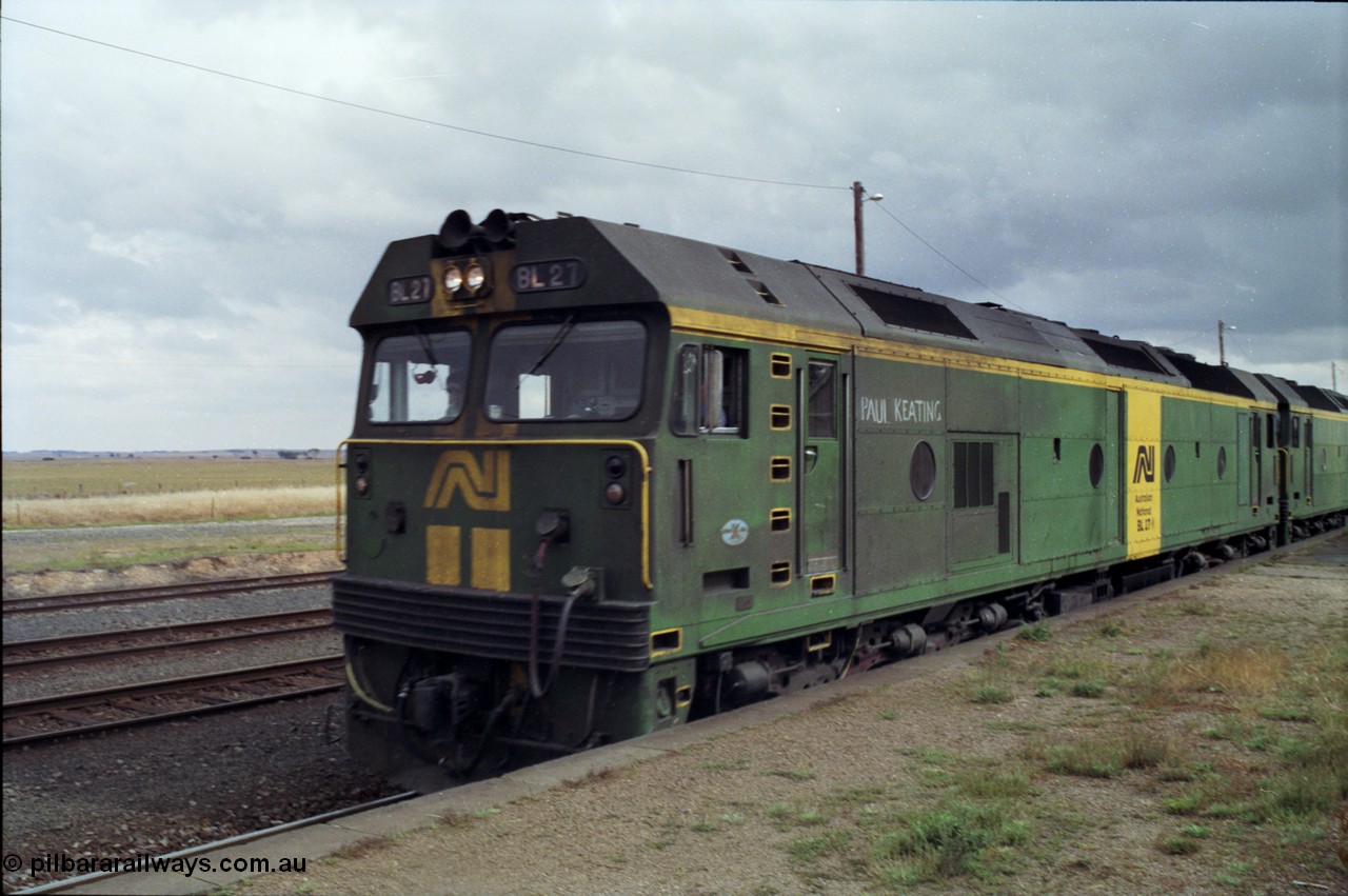 178-13
Maroona, station platform, Australian National BL class locomotive BL 27 Clyde Engineering EMD model JT26C-2SS serial 83-1011 with Paul Keating chalked on runs along the platform with V/Line's broad gauge down goods train to Adelaide, 9169.
Keywords: BL-class;BL27;Clyde-Engineering-Rosewater-SA;EMD;JT26C-2SS;83-1011;